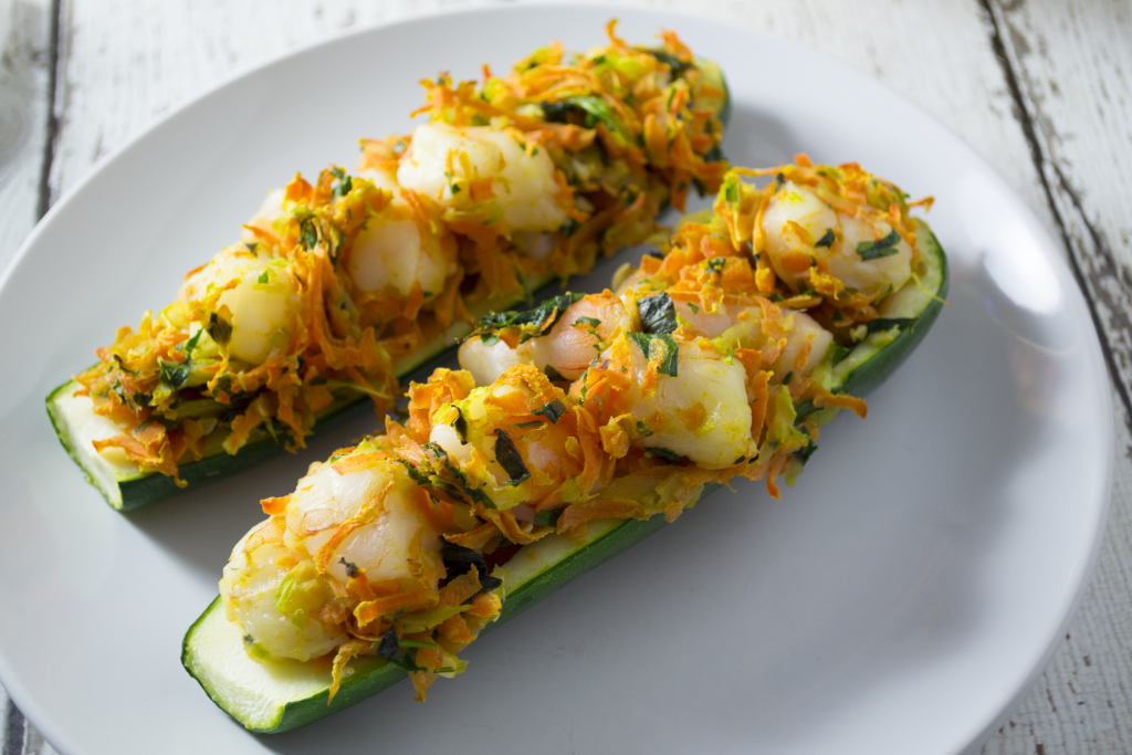 These shrimp stuffed zucchini boats are a great twist on an everyday vegetable. Paleo, gluten free, and whole 30 approved! These are a show stopper! - OCD Kitchen