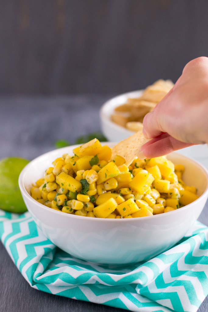 A slightly sweet corn and mango salsa is the perfect way to switch up your game day appetizers! - OCD Kitchen