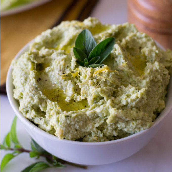 Spread on a sandwich, a cracker, or dip all types of vegetable sticks in this edamame hummus as a snack. A hummus recipe w/ fresh herbs and lots of flavor. - OCD Kitchen