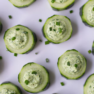 Easy no cook dinner party appetizer. Creamy tangy goat cheese with herbs in a cute cucumber cup.